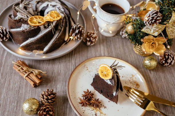 istock Christmas fruit cake, loaf on cooling rack with cup of tea. Grey background. 1426682035