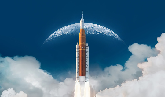 SLS space rocket in sky with clouds. Mission to Moon. Spaceship launch from Earth. Orion spacecraft. Artemis space program to research solar system. Elements of this image furnished by NASA (url: https://www.nasa.gov/sites/default/files/thumbnails/image/ksc-20220318-ph-kls03_0079large.jpg)