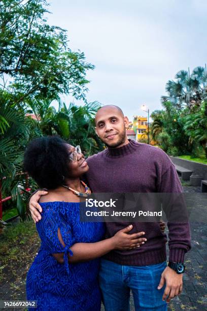 Cute Portrait Of An Afrodescendant Married Male And Female Couple Standing Together At Plaza V Centenario In Panama City Panama Stock Photo - Download Image Now