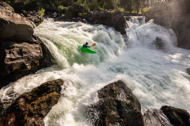 Kayaker Plunging Down a Waterfall stock photo