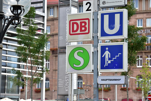 Various public transport signs in front of the train station in the old town of Nuremberg, Bavaria