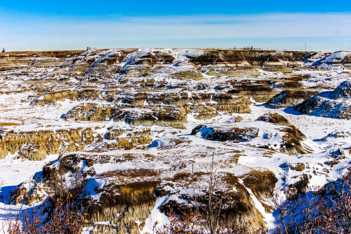 Snow starts to melt in Horseshoe Canyon, Drumheller, Alberta, Canada