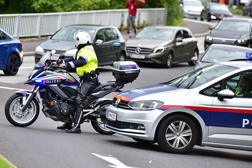 Police motorcycle in front of a traffic jam in Linz, Austria
