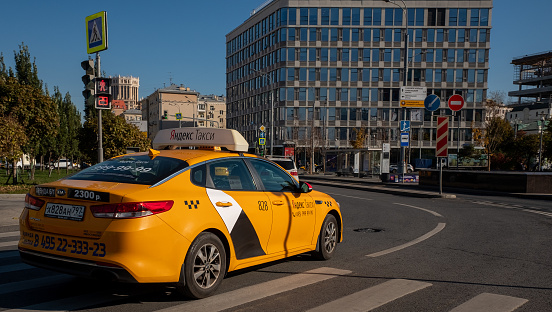 October 12, 2021, Moscow, Russia. A passenger car of the Yandex taxi service on one of the streets in the Russian capital.