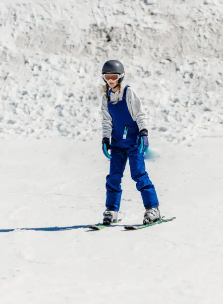 Photo of Child skis down easy ski slope