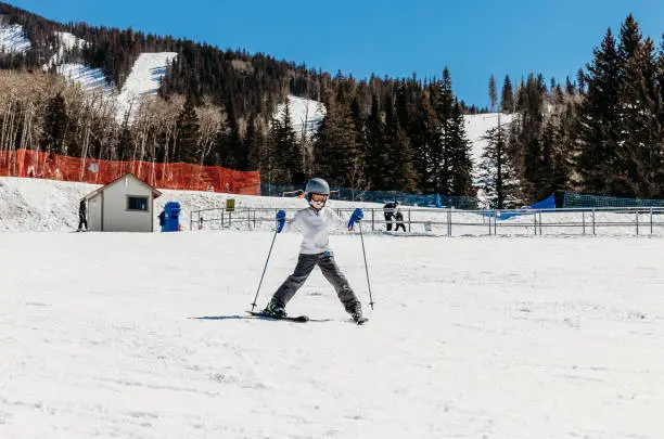 Photo of Child skis down easy ski slope