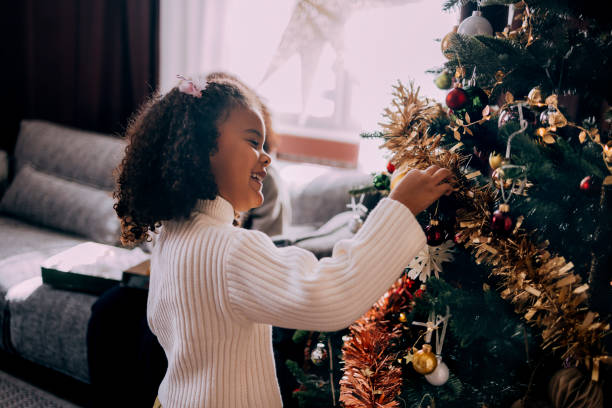 istock Girl Decorating A Christmas Tree 1426708809