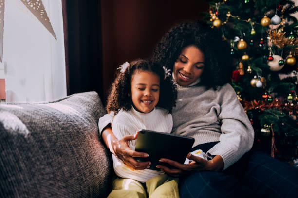 istock Mother And Daughter Watching Cartoons On A Tablet Device 1426708843
