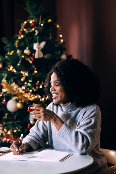 istock Anonymous Woman Writing Plans In Her Notebook 1426708960