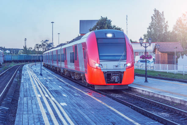istock Passenger train stands by the platform at early morning. 1426710168
