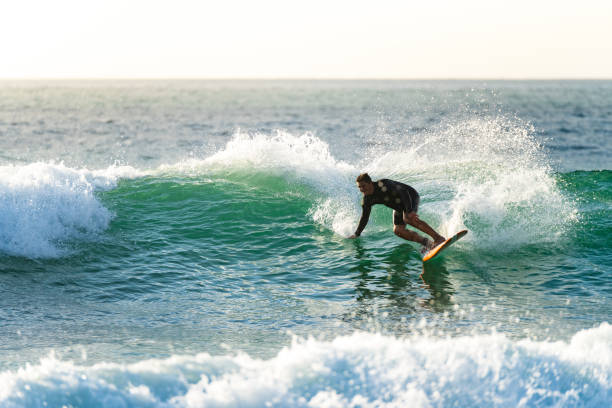 istock Surfer in action at sunset 1426711563