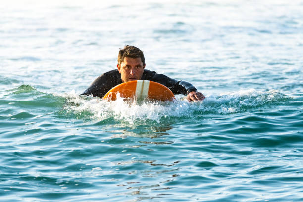 istock Surfer on longboard over the water 1426711909