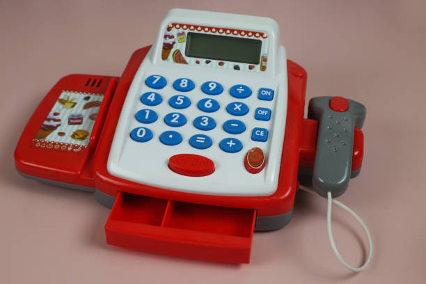 Toy store with food. Children's set with a cash register and products for development. Plastic food and money counting calculator.