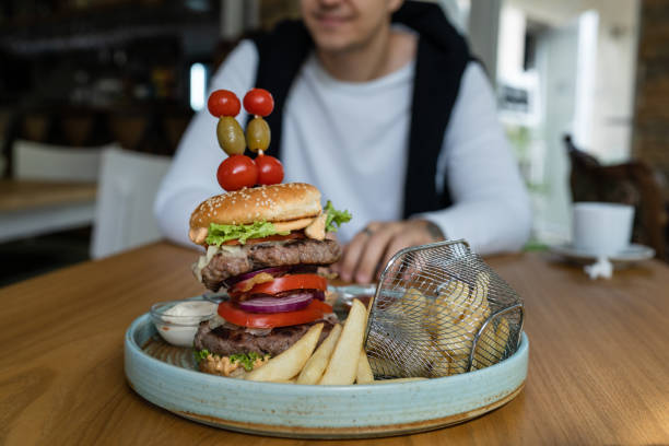 istock close up on burger in a plate on the table at the restaurant 1426722684