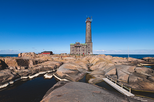 Bengtskär Lighthouse, view of Bengtskar island in Archipelago Sea, Finland, Kimitoön, Gulf of Finland in a summer sunny day