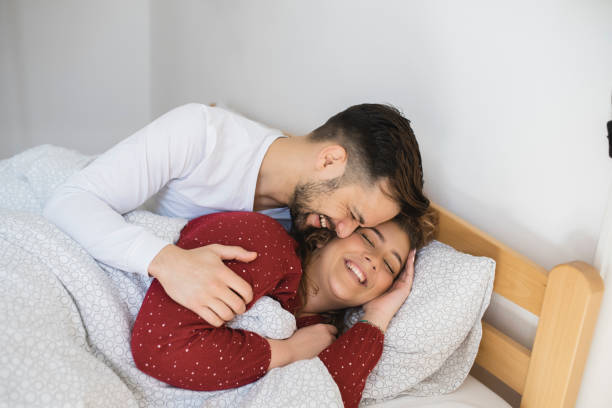 istock Woman awaking in her husband's embrace 1426728721