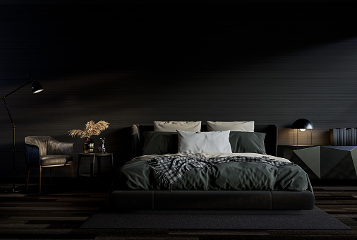 Modern style black bedroom interior with empty wall 3d render.There are black wooden floor ,black wallpaper,decorated with dark gray fabric and leather furniture