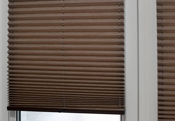 istock Pleated blinds close up on the window in the interior 1426742735