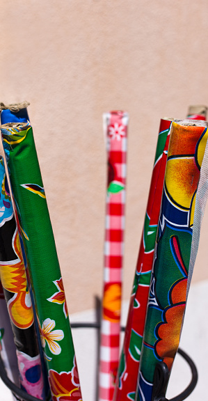 Retail Display: Rolls of Mexican Oilcloth Outside. Shot in Taos, NM.