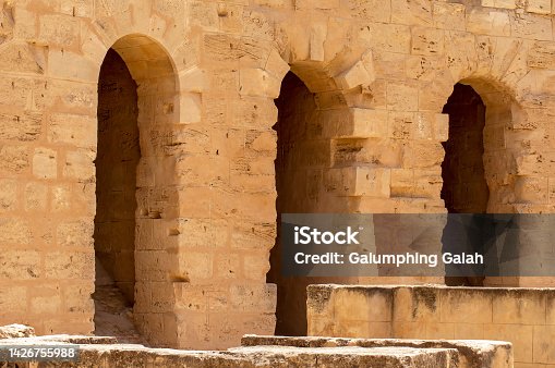 istock Arches in the ruins of ancient roman era amphitheatre, El Djem, Tunisia 1426755988