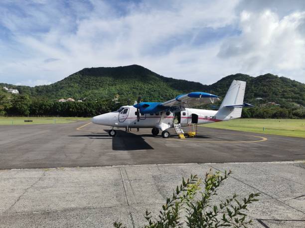 De Havilland Canada DHC-6-300 Twin Otter in the Lauriston Airport, Carriacou, Grenada. Carriacou, Grenada- August 19, 2022- De Havilland Canada DHC-6-300 Twin Otter on the Runway of the Lauriston Airport in Hillsborough. This Aircraft is Operated by  SVG Air Airline. On this day this aircraft was used to transport passengers from the island of Carriacou to Grenada. de havilland dhc 6 twin otter stock pictures, royalty-free photos & images