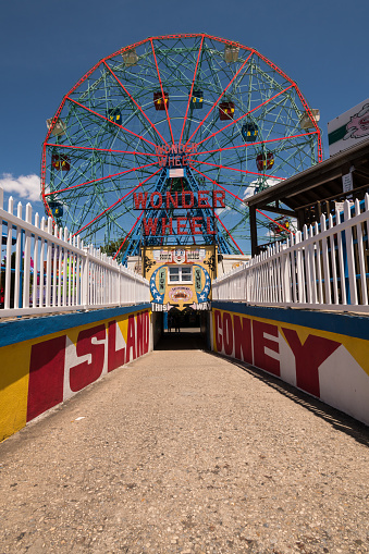 New York, USA - Jun 4, 2019: The Iconic Coney Island tunnel leading from the beach to the famous Wonder Wheel late in the day.