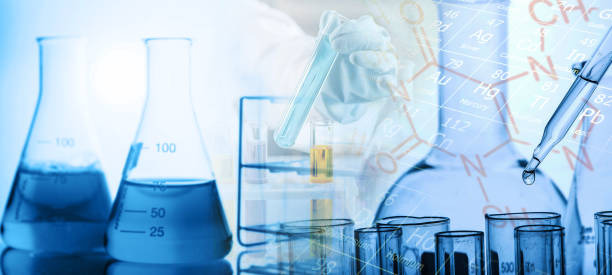 Laboratory research, dropping liquid to test tube. Test tube containing chemical liquid in laboratory, lab chemistry or science research and development concept. stock photo