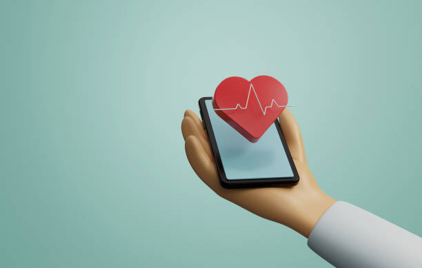 istock Hand holding cell phone with heart and pulse icons floating on screen. 1426763264