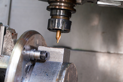 Center drilling tool on a 5 axis CNC milling machine in production