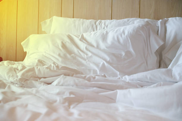 istock white bed and pillows in the room 1426785213