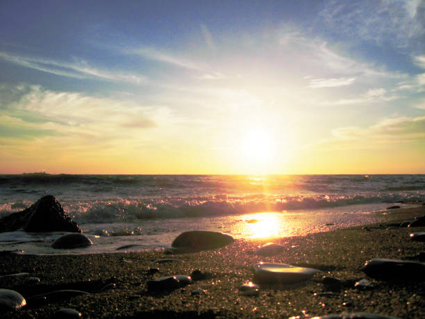 Sunset over summer sea with a small waves