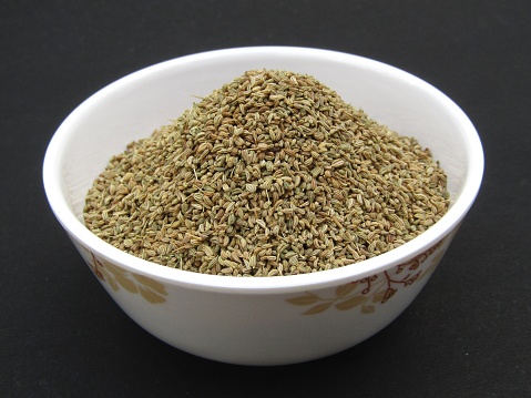 carom seed or ajwain in a bowl on black background