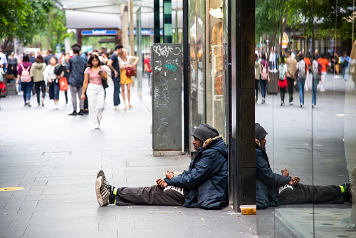 Sydney, Australia. - On October 16, 2019. - Australian aboriginal man homeless sitting on the ground at Sydney downtown.
