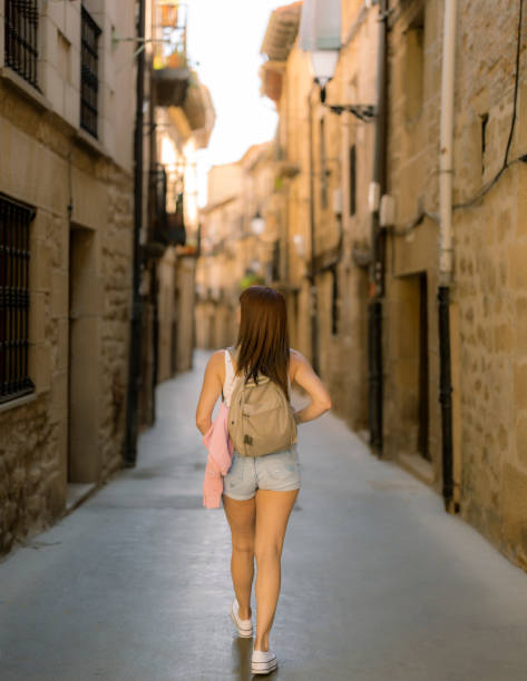 istock woman traveler visiting a medieval village 1426796565