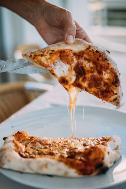 istock Cutting margherita pizza 1426808118