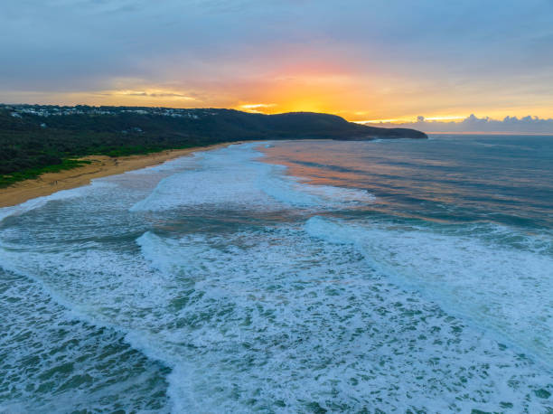 istock Cloud covered sunrise at the seaside in soft pastel shades 1426809675