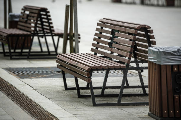 istock Empty bench in the city square, close-up 1426813335