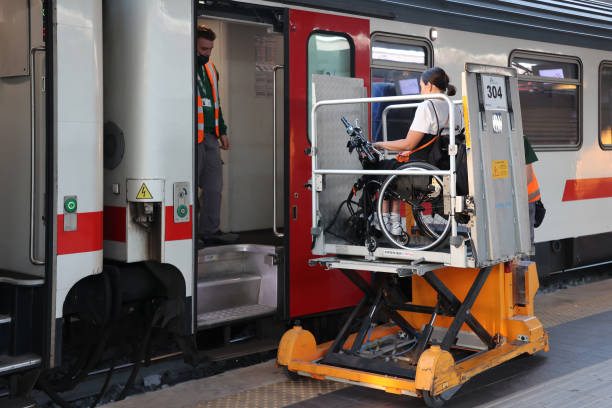 Passenger with reduced mobility. Disabled person transport by train. stock photo