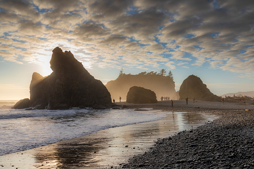 dramatic sunset sky with silhouette of  sea stacks on the background in Ruby beach at the Olympic national park in Washington State.