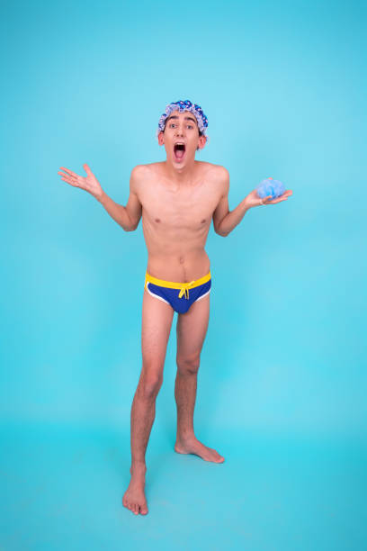 istock A young attractive guy washes in the shower. 1426824592