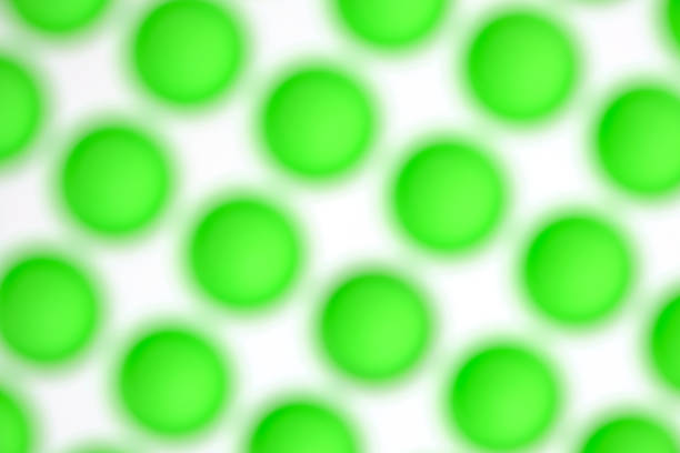 Abstract blurred background with green balls