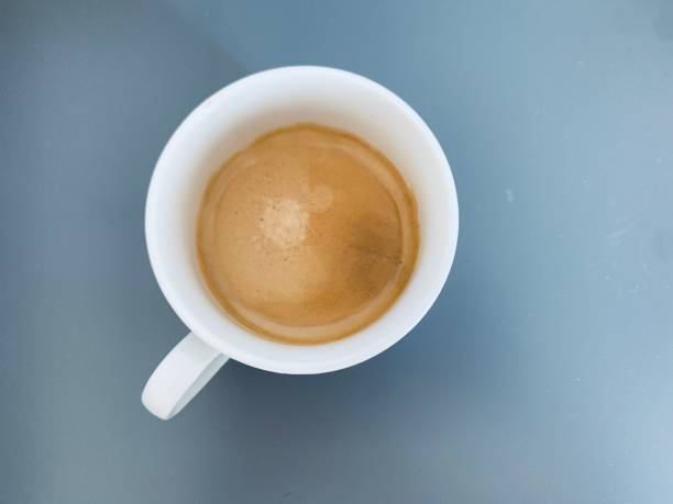 istock cup of coffee on the table. Top view 1426825300