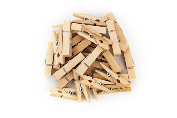 istock Wooden clothespins on white background. 1426827828