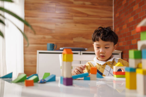 istock little boy playing with blocks on the balcony 1426832584