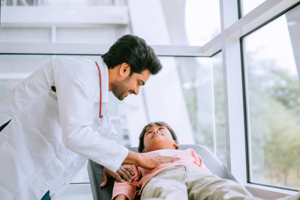 istock The doctor examines the patient on the table 1426833322