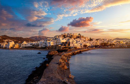 View from the Portara Gate towards the city of Naxos island, Cyclades, Greece, during a beautiful summer sunset