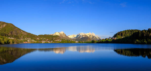 istock Skopp Mountain range reflected in Norwegian Lake near Alesund 1426837259