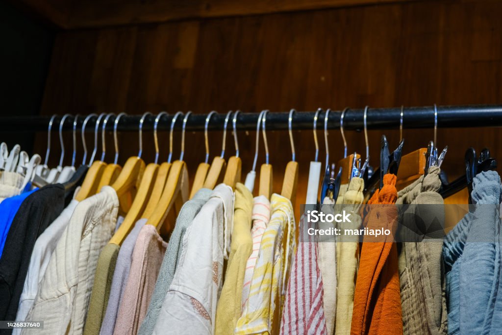 Clothes on hangers in a retail shop Clothes on hangers in a retail shop. Fashion concept Fashion Show Stock Photo