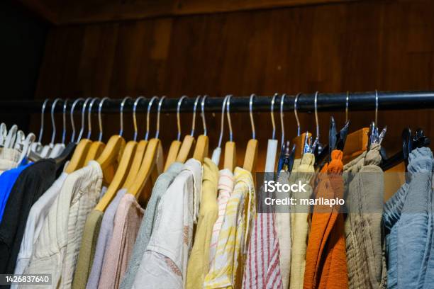 Clothes On Hangers In A Retail Shop Stock Photo - Download Image Now - Fashion Show, Clothesline, Shirt