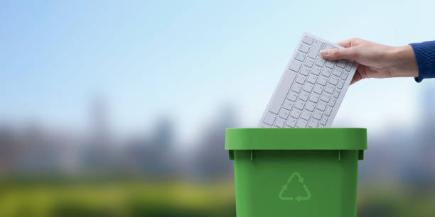 Throwing many crumpled paper ball into black garbage at the office. Its can use recycle or reuse. , Recycle concept.